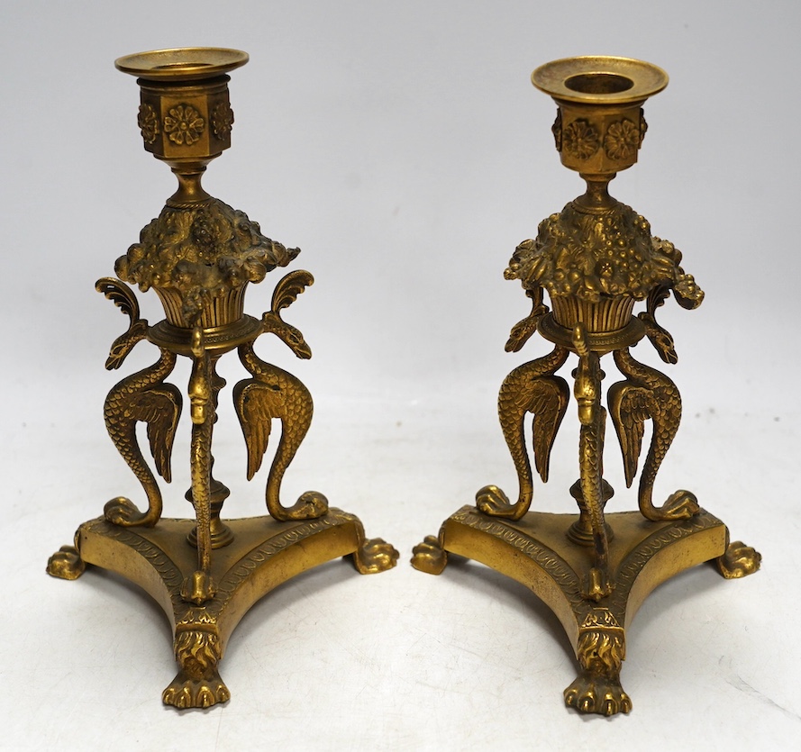 A pair of Empire style ormolu candlesticks, 20cm. Condition - fair to good